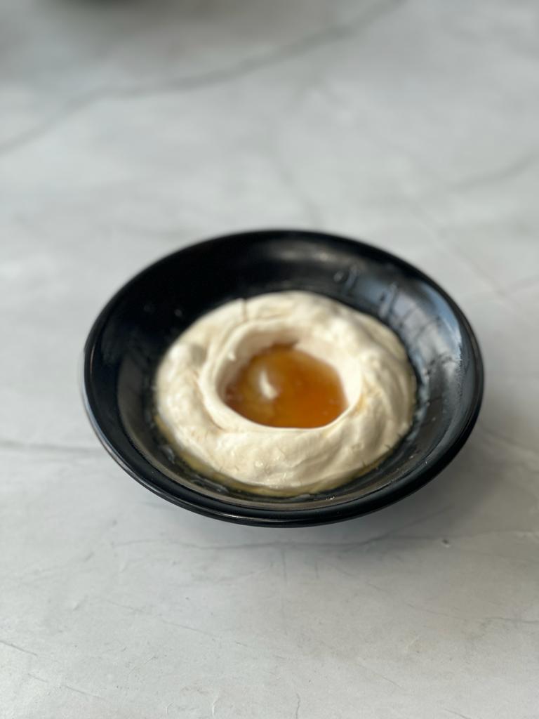 A plate of cream and honey